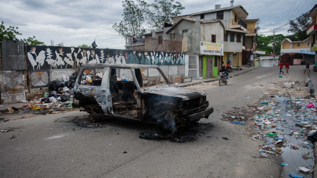 A burnt-out car is seen during a protest against insecurity in Port-au-Prince. AFP A burnt-out car is seen during a protest against insecurity in Port-au-Prince. AFP