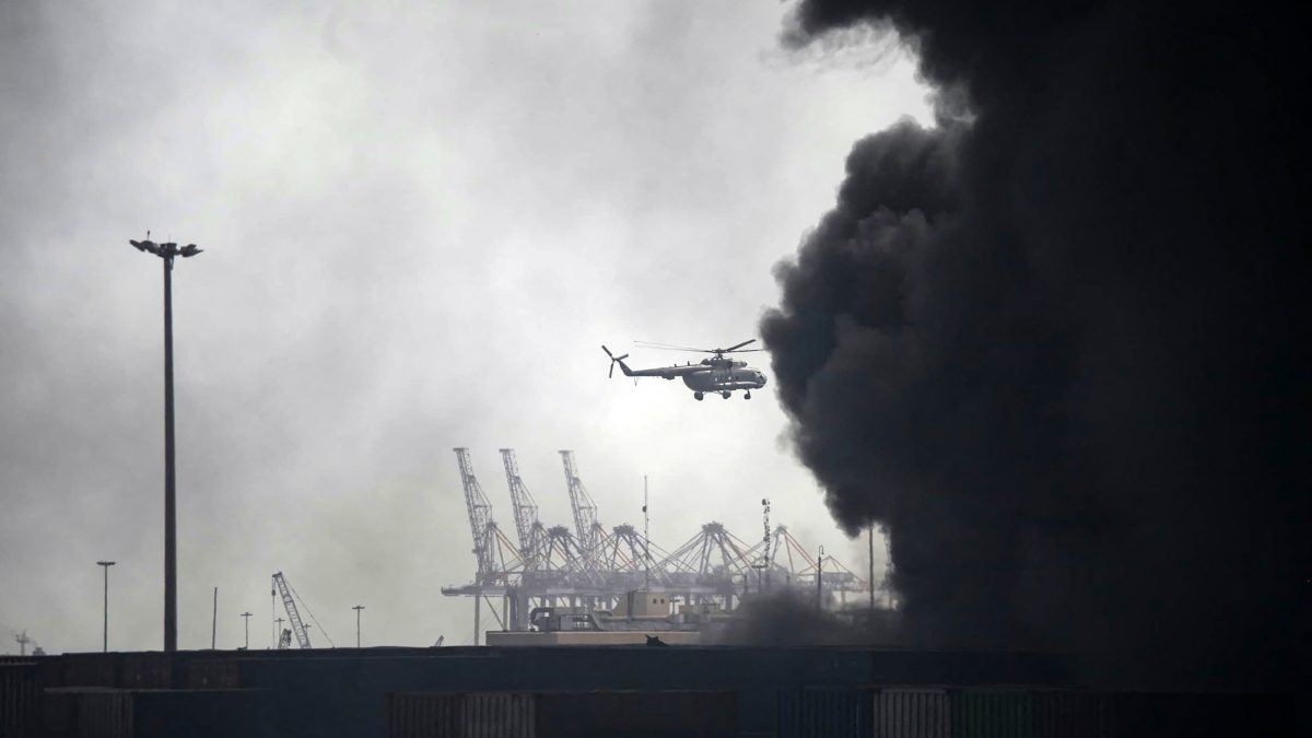 A helicopter flies above the smoke following an explosion at the Shahid Rajaee port dock southwest of Bandar Abbas in the Iranian province of Hormozgan. AFP A helicopter flies above the smoke following an explosion at the Shahid Rajaee port dock southwest of Bandar Abbas in the Iranian province of Hormozgan. AFP