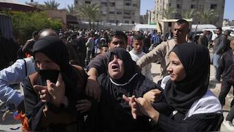Mourners react during the funeral of 8 Red Crescent emergency responders, recovered in Rafah a week after an Israeli attack, in Deir al-Balah, Gaza Strip. AP
