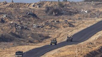 Israeli military vehicles move inside the Gaza Strip, as seen from southern Israel. File image/ AP