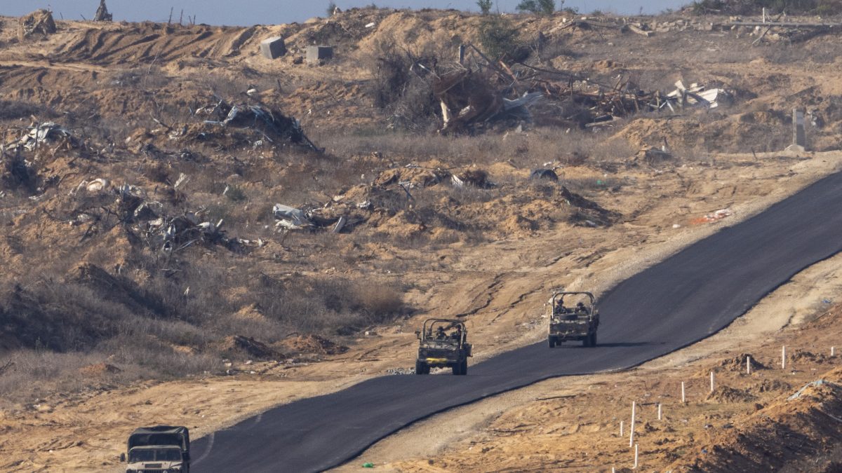 Israeli military vehicles move inside the Gaza Strip, as seen from southern Israel. File image/ AP Israeli military vehicles move inside the Gaza Strip, as seen from southern Israel. File image/ AP