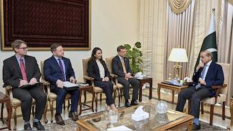 In this photo released by the Pakistan's Prime Minister Office, a U.S delegation led by Eric Meyer, fourth left, senior Bureau Official for the State Department's Bureau of South and Central Asian Affairs, met with Pakistan's Prime Minister Shehbaz Sharif, in Islamabad, Pakistan. AP
