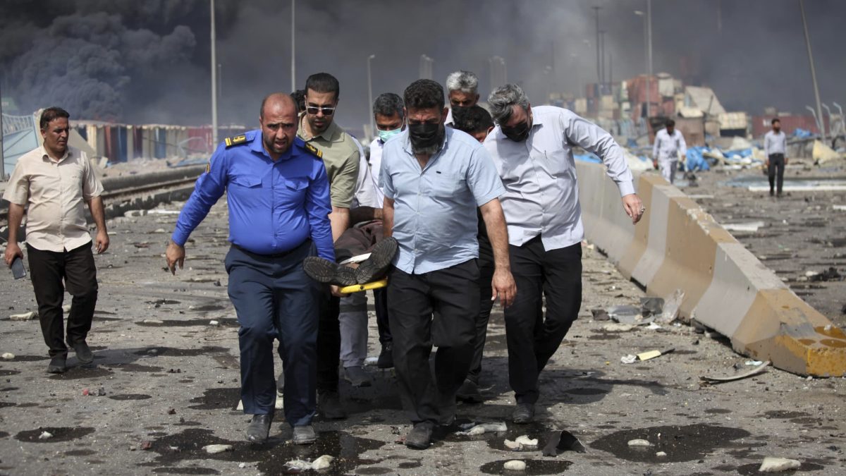 In this photo provided by Islamic Republic News Agency, IRNA, men carry an injured man after a massive explosion near the southern port city of Bandar Abbas, Iran. AP In this photo provided by Islamic Republic News Agency, IRNA, men carry an injured man after a massive explosion near the southern port city of Bandar Abbas, Iran. AP