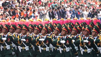 Vietnamese troops march during a parade to commemorate the 50th anniversary of the end of the Vietnam War in Ho Chi Minh City, Vietnam. AP