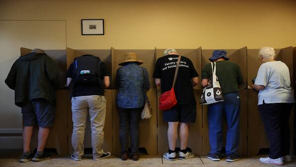 Australians vote in an election swayed by the Trump effect & inflation
