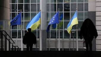 Flags of Ukraine fly in front of the EU Parliament building. Europe sees the Ukraine war mainly through the normative lens of democracy vs autocracy. Image: REUTERS 