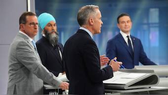 (File) Bloc Quebecois Leader Yves-Francois Blanchet, New Democratic Party Leader Jagmeet Singh and Conservative Leader Pierre Poilievre listen to Liberal leader Mark Carney speak during the French-language federal leaders' debate, in Montreal on April 16, 2025. AP
