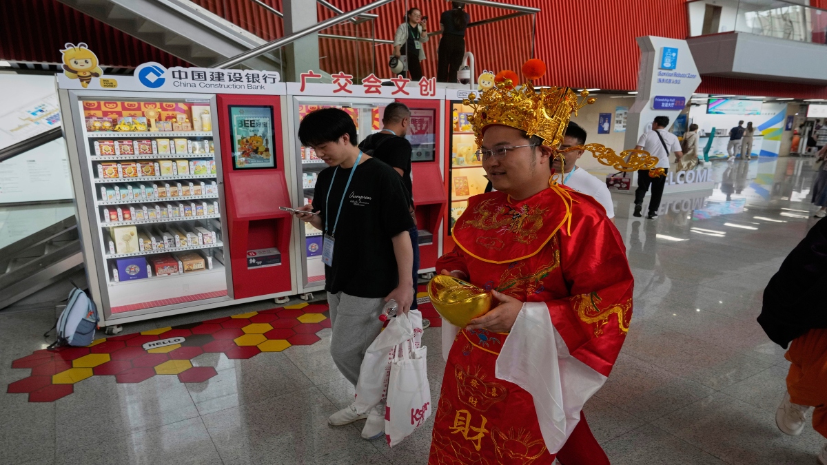 A man dressed as the god of fortune walks through the 137th Canton Fair in Guangzhou in southern China's Guangdong province on Wednesday. AP File A man dressed as the god of fortune walks through the 137th Canton Fair in Guangzhou in southern China's Guangdong province on Wednesday. AP File
