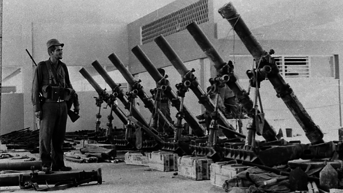 A soldier of the Cuban Armed Forces stands next to US-built armaments captured after some 1,500 anti-Castro allies came ashore at Playa Giron beach during the Bay of Pigs invasion on the south coast of Cuba, in this April 1961 photo. File Image/Reuters A soldier of the Cuban Armed Forces stands next to US-built armaments captured after some 1,500 anti-Castro allies came ashore at Playa Giron beach during the Bay of Pigs invasion on the south coast of Cuba, in this April 1961 photo. File Image/Reuters