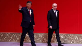 In this pool photograph distributed by the Russian state agency Sputnik, Russia's President Vladimir Putin and China's President Xi Jinping attend a concert marking the 75th anniversary of the establishment of diplomatic relations between Russia and China and opening of China-Russia Years of Culture at the National Centre for the Performing Arts in Beijing on May 16, 2024. (Photo via AFP)
