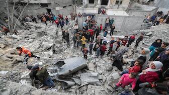 Palestinians gather at the site of an Israeli strike on a house as rescuers attempt to remove casualties from under the rubble, in Jabalia in the northern Gaza Strip, on April 13, 2025. Reuters File