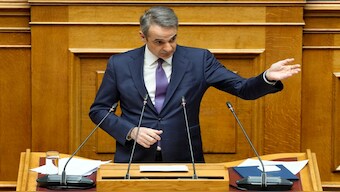 Greece's Prime Minister Kyriakos Mitsotakis speaks during a presentation of military spending plans, at the Greek Parliament, in Athens, on Wednesday. AP