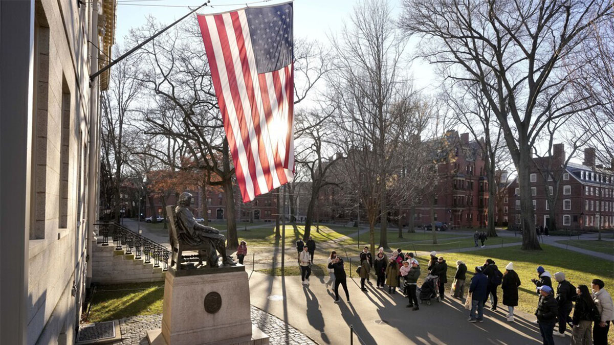 (File) People take photographs near a John Harvard statue, left, on the campus of Harvard University, in Cambridge, Mass. Harvard University. AP (File) People take photographs near a John Harvard statue, left, on the campus of Harvard University, in Cambridge, Mass. Harvard University. AP