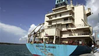 Maersk-Alabama captain Richard Phillips, (R), stands alongside Cmdr. Frank Castellano, the commanding officer of USS Bainbridge, after being rescued by U.S Naval Forces off the coast of Somalia, April 12, 2009. File image/Reuters