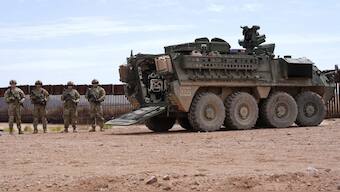 Members of US Army stand next to an M1126 Stryker vehicle parked at the US-Mexico border, as a part of joint Task Force Southern Border (Photo:AP)