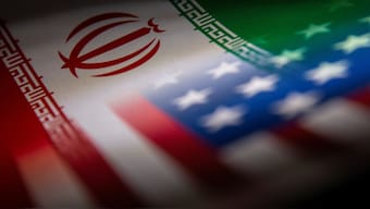 Iran's and US' flags are seen printed on paper in this illustration taken on January 27, 2022. Reuters File 