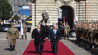 Hungarian Prime Minister Viktor Orban and Israeli Prime Minister Benjamin Netanyahu walk on the red carpet during a welcoming ceremony at the Lion's Courtyard in Budapest, Hungary, on Thursday. Reuters