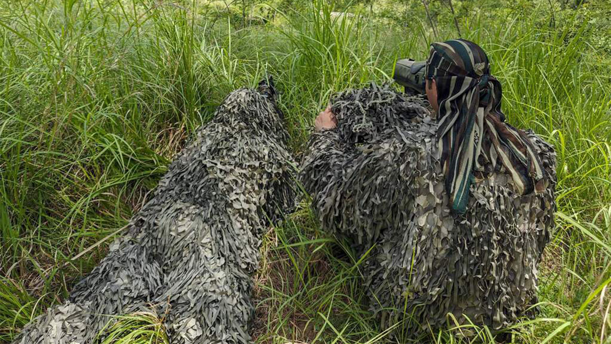 A sniper of Indian Army and his buddy on 'spotter-scope' while on ambush duty on Line of Control (LoC) at a forward location in Nowshera sector of Jammu and Kashmir's Rajouri district. PTI A sniper of Indian Army and his buddy on 'spotter-scope' while on ambush duty on Line of Control (LoC) at a forward location in Nowshera sector of Jammu and Kashmir's Rajouri district. PTI