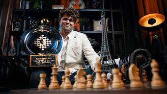 Magnus Carlsen poses with the winner's trophy after defeating Hikaru Nakamura in the final of the Freestyle Chess Grand Slam Tour in Paris. Image credit: Freestyle Chess