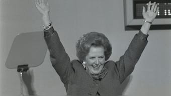 UK's Prime Minister Margaret Thatcher raises both hands over head and smiles during standing ovation after her closing speech at the Conservative Party Conference in Blackpool, England, October 9, 1987. File Image/Reuters