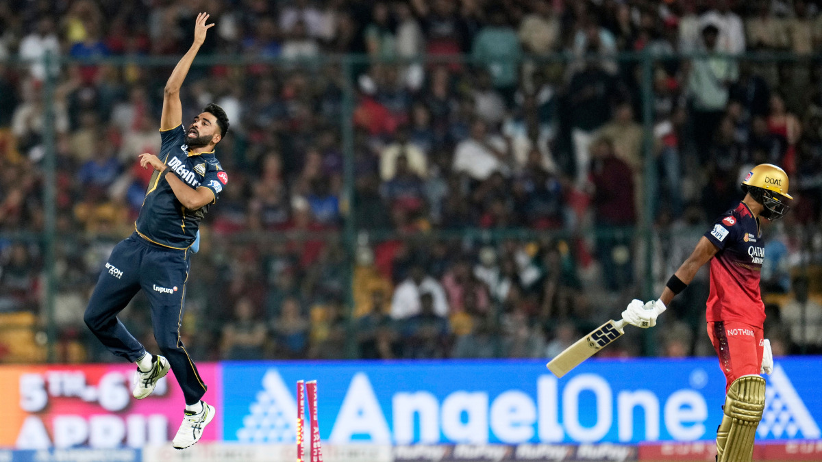 Gujarat Titans pacer Mohammed Siraj celebrates after dismissing Royal Challengers Bengaluru batter Devdutt Padikkal at the M Chinnaswamy Stadium in Bengaluru. AP Gujarat Titans pacer Mohammed Siraj celebrates after dismissing Royal Challengers Bengaluru batter Devdutt Padikkal at the M Chinnaswamy Stadium in Bengaluru. AP