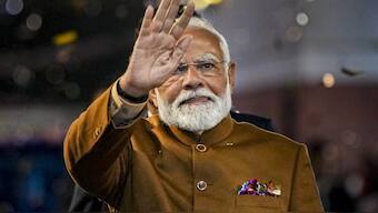 New Delhi: Prime Minister Narendra Modi greets supporters upon his arrival at BJP headquarters, on the day of counting of votes for Delhi Assembly elections, in New Delhi, Saturday, Feb. 8, 2025. The BJP won 40 seats and AAP 19 in the Delhi Assembly elections results of which were announced on Saturday. (PTI Photo/Arun Sharma) (PTI02_08_2025_000389B)