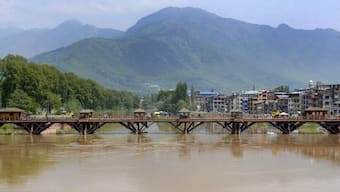 Swollen Jhelum river following heavy rains, in Srinagar. PTI