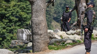 Security personnel stand guard a day after a terrorist attack in Pahalgam. PTI