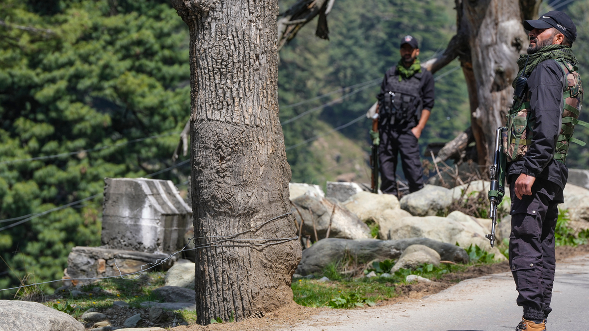 Security personnel stand guard a day after a terrorist attack in Pahalgam. PTI Security personnel stand guard a day after a terrorist attack in Pahalgam. PTI
