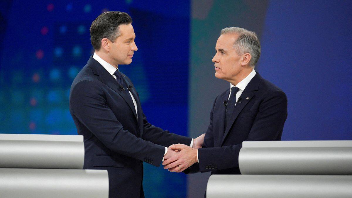 Conservative Leader Pierre Poilievre and Liberal Leader Mark Carney shake hands following the English-language federal leaders' debate in Montreal, Canada, April 17, 2025. File Image/Reuters
