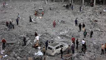In this aerial view, Palestinians check the devastation in the yard of a destroyed school, a day after it was hit by an Israeli strike, in the al-Tuffah neighbourhood of Gaza City on April 4, 2025. Image- AFP