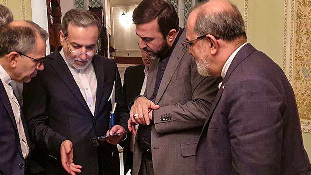 This handout picture provided by Khabar Online on April 12, 2025, shows Iran's Foreign Minister Abbas Araghchi (2nd-L) speaking with members of the Iranian delegation after a meeting in Muscat. Image- AFP This handout picture provided by Khabar Online on April 12, 2025, shows Iran's Foreign Minister Abbas Araghchi (2nd-L) speaking with members of the Iranian delegation after a meeting in Muscat. Image- AFP