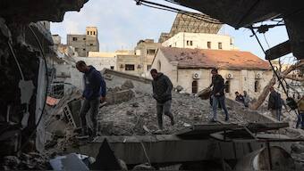 People check the destruction in the aftermath of an Israeli strike on the Al-Ahli hospital, also known as the Baptist or Ahli Arab hospital, in Gaza City on April 13, 2025.  AFP Photo