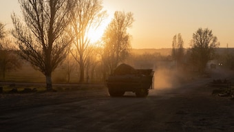 An armoured Ukrainian military vehicle drives on a road in a village not far from the frontline in the Dnipropetrovsk region, on April 19, 2025, amid the Russian invasion of Ukraine. AFP Photo