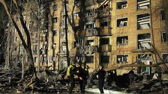 Ukrainian police officers stand near a damaged building after a Russian ballistic missile attack in Kyiv, Ukraine, early Thursday, April 24, 2025. (AP Photo)