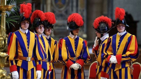 They guard the Pope in life and death: A look at the storied history of the Swiss Guard