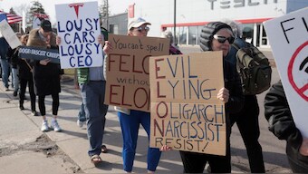 Demonstrators protest against Elon Musk in front of a Tesla dealership in Ann Arbor, Michigan, US, March 21, 2025. File Image/Reuters