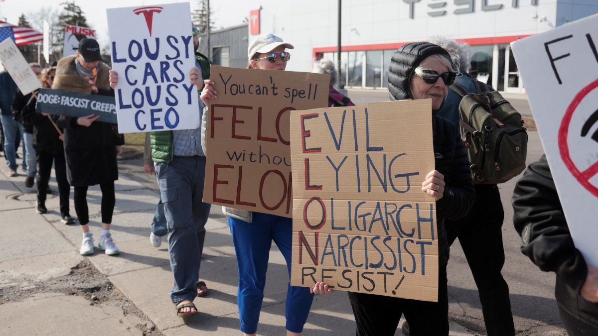 Demonstrators protest against Elon Musk in front of a Tesla dealership in Ann Arbor, Michigan, US, March 21, 2025. File Image/Reuters Demonstrators protest against Elon Musk in front of a Tesla dealership in Ann Arbor, Michigan, US, March 21, 2025. File Image/Reuters