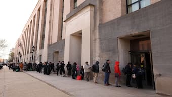 Employees of the Department of Health and Human Services (HHS) queue outside the Mary E. Switzer Memorial Building, after it was reported that the Trump administration fired staff at the Centers for Disease Control and Prevention and at the Food and Drug Administration, as it embarked on its plan to cut 10,000 jobs at HHS, in Washington, DC, US, on Tuesday. Reuters