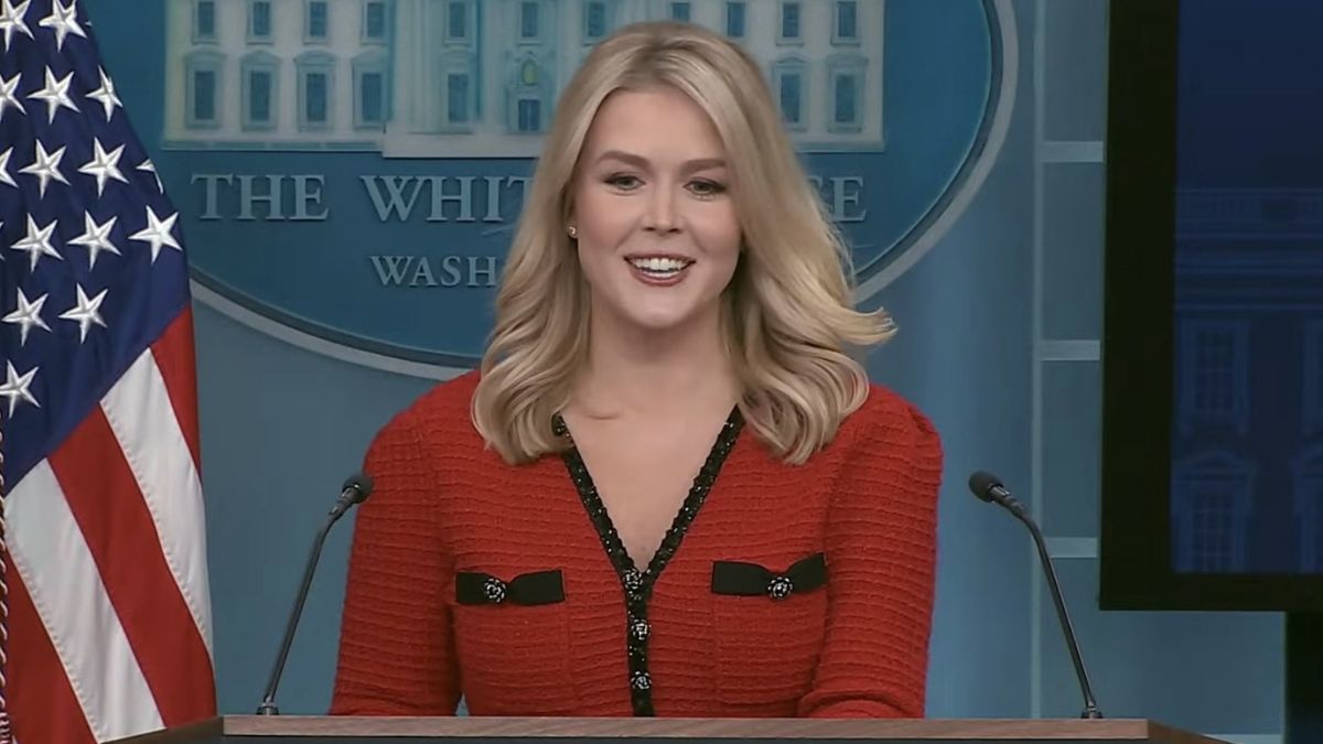 Karoline Leavitt appeared in a red and black lace dress that quickly drew attention on social media. X/@Byron_Wan
 Karoline Leavitt appeared in a red and black lace dress that quickly drew attention on social media. X/@Byron_Wan