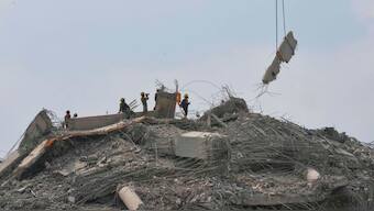 Rescuers use heavy machinery to clear the huge slabs of concrete from the site of an under-construction high-rise building that collapsed after an earthquake in Bangkok, Thailand, April 1, 2025. AP