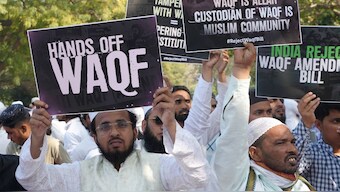 People hold placards during a protest by the All India Muslim Personal Law Board (AIMPLB) against the Waqf (Amendment) Bill at Jantar Mantar, in New Delhi, March 17, 2025. PTI