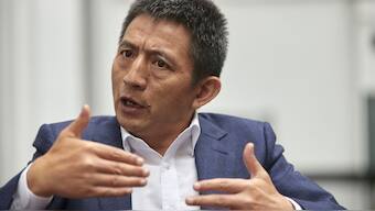 Li Chenggang, China's Ambassador to the World Trade Organisation (WTO), gestures during an interview. Reuters