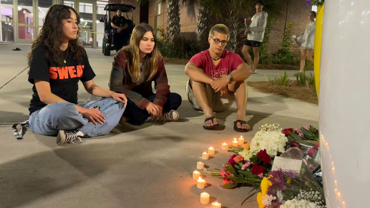 People sit in front of a makeshift memorial outside the student union at Florida State University, Thursday, April 17, 2025, in Tallahassee, Fla., following a campus shooting. AP People sit in front of a makeshift memorial outside the student union at Florida State University, Thursday, April 17, 2025, in Tallahassee, Fla., following a campus shooting. AP