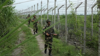 Border Security Force (BSF) soldiers patrol near the India Pakistan border fencing at Garkhal in Akhnoor, about 35 kilometers west of Jammu, August 13, 2019. File Photo/AP