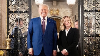 Giorgia Meloni posing with Donald Trump at his Mar-A-Lago Club. AFP/File Photo
