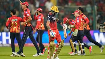 Virat Kohli walks back to the Royal Challengers Bengaluru dugout after getting dismissed by Punjab Kings seamer Arshdeep Singh at the M Chinnaswamy Stadium in Bengaluru. AP