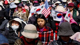 Far-right protesters react after hearing that President Yoon Suk Yeol's impeachment was accepted, near his residence in Seoul, South Korea, April 4, 2025. Reuters