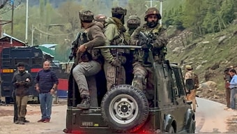 Security personnel move towards the site after terrorists attacked a group of tourists at Pahalgam, in Anantnag district. PTI