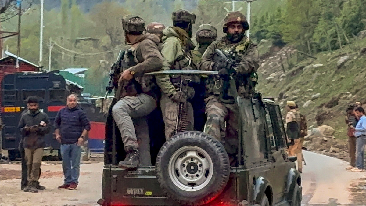 Security personnel move towards the site after terrorists attacked a group of tourists at Pahalgam, in Anantnag district. PTI Security personnel move towards the site after terrorists attacked a group of tourists at Pahalgam, in Anantnag district. PTI
